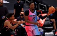 Bam Adebayo #13 of the Miami Heat passes away from Kyle Lowry #7 of the Toronto Raptors.